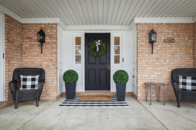 4396 Laurel Dr, Saint Joseph, MI 49085 - view of exterior entry with brick siding and a porch