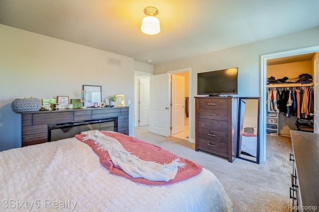 32879 Birchwood Dr, Chesterfield, MI 48047 - bedroom with light colored carpet, a spacious closet, and a closet