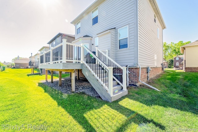 32879 Birchwood Dr, Chesterfield, MI 48047 - rear view of property with stairway, a lawn, and a deck