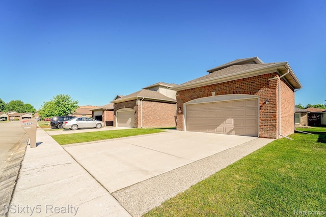 32879 Birchwood Dr, Chesterfield, MI 48047 - view of front of property with brick siding, a front lawn, driveway, and an attached garage