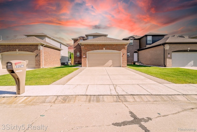 32879 Birchwood Dr, Chesterfield, MI 48047 - view of front of property featuring a front yard, brick siding, and concrete driveway