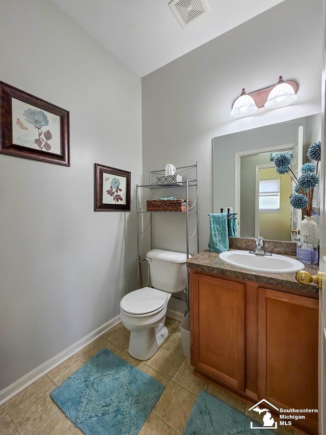 1997 Teton Ave, Monroe, MI 48162 - bathroom featuring toilet, vanity, baseboards, and tile patterned floors