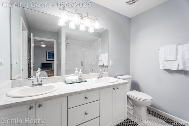 2870 Grand Marais Dr, Howell, MI 48843 - bathroom with double vanity, a shower stall, tile patterned flooring, toilet, and ensuite bath