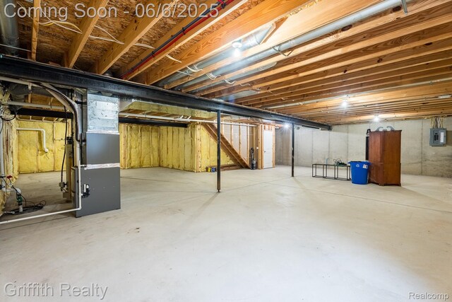 2870 Grand Marais Dr, Howell, MI 48843 - unfinished below grade area featuring electric panel and heating unit