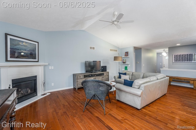 2870 Grand Marais Dr, Howell, MI 48843 - living room featuring a ceiling fan, wood finished floors, lofted ceiling, a glass covered fireplace, and baseboards