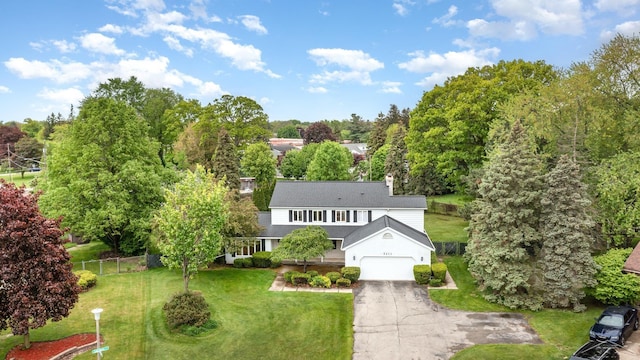 5211 S Gatesboro Dr, Saginaw, MI 48603 - aerial view of property and surrounding area with a tree filled landscape