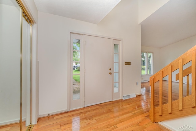 5211 S Gatesboro Dr, Saginaw, MI 48603 - entrance foyer featuring light wood finished floors, stairs, and baseboards