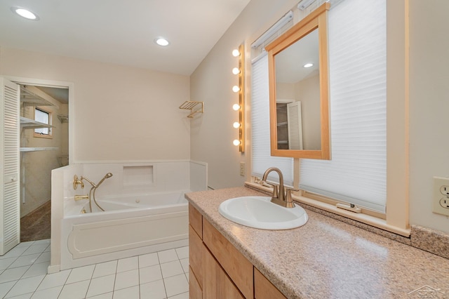 5211 S Gatesboro Dr, Saginaw, MI 48603 - bathroom featuring tile patterned flooring, a bath, vanity, and recessed lighting