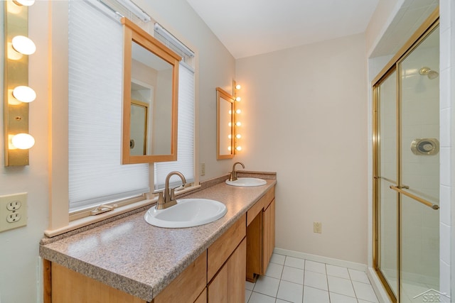 5211 S Gatesboro Dr, Saginaw, MI 48603 - bathroom featuring double vanity, tile patterned floors, and tiled shower