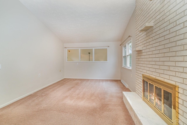 5211 S Gatesboro Dr, Saginaw, MI 48603 - unfurnished living room featuring a brick fireplace, light colored carpet, baseboards, and a textured ceiling