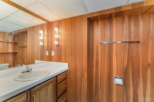 5211 S Gatesboro Dr, Saginaw, MI 48603 - bathroom with vanity, wood walls, and toilet