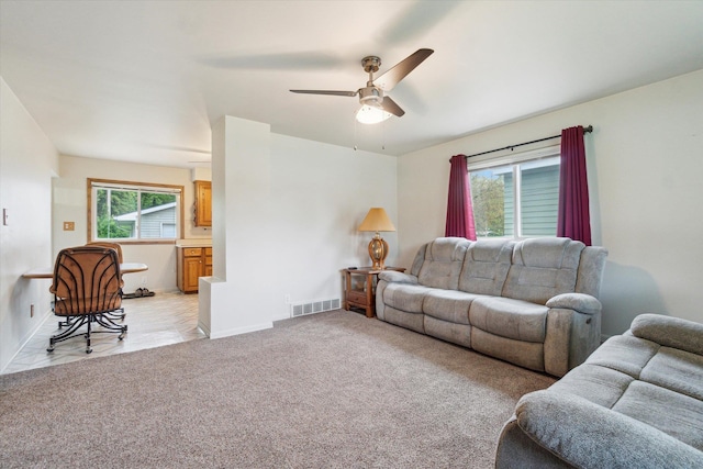 5371 Durwood Dr, Swartz Creek, MI 48473 - living room featuring a ceiling fan, baseboards, and light colored carpet