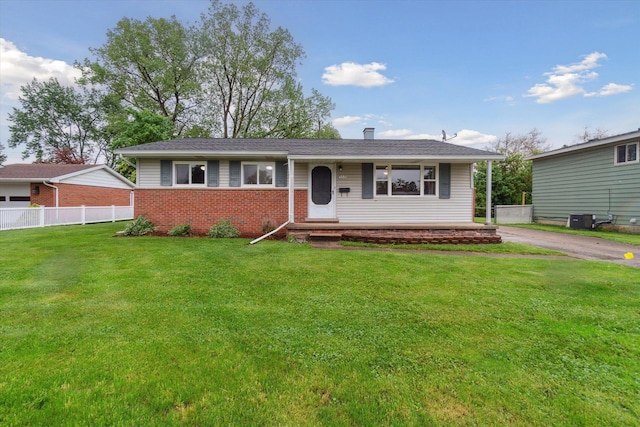 5371 Durwood Dr, Swartz Creek, MI 48473 - ranch-style house featuring brick siding, covered porch, and central air condition unit