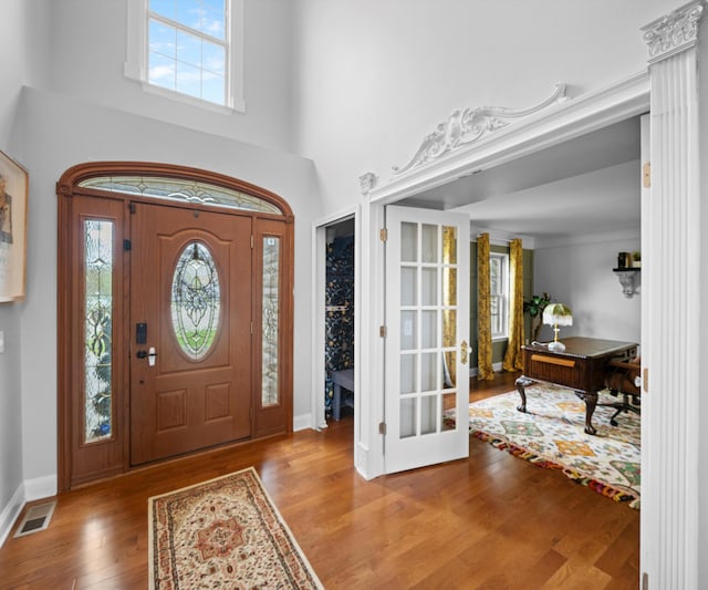 1150 Heatherlea Ct, Canton, MI 48188 - entrance foyer with plenty of natural light, wood finished floors, baseboards, and a towering ceiling