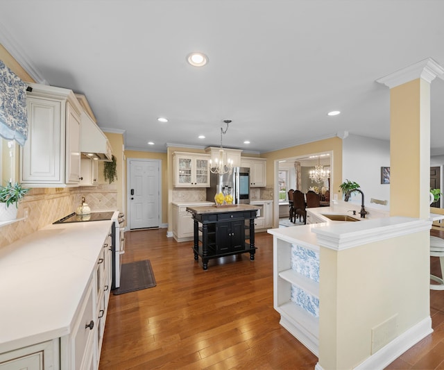 1150 Heatherlea Ct, Canton, MI 48188 - kitchen featuring a sink, a chandelier, stainless steel fridge with ice dispenser, a center island, and tasteful backsplash