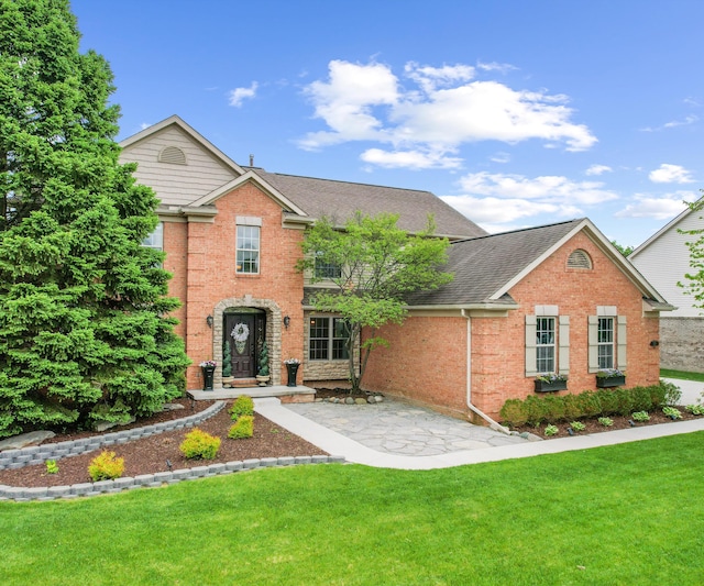 1150 Heatherlea Ct, Canton, MI 48188 - traditional home with brick siding, a front lawn, and a shingled roof