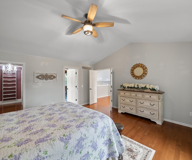 1150 Heatherlea Ct, Canton, MI 48188 - bedroom with vaulted ceiling, wood finished floors, a ceiling fan, a walk in closet, and baseboards