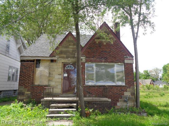 13493 Conley St, Hamtramck, MI 48212 - english style home featuring a chimney, brick siding, and a shingled roof