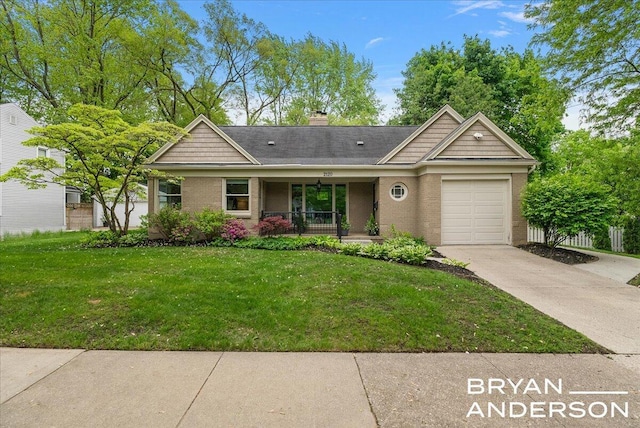 2120 Englewood Dr SE, East Grand Rapids, MI 49506 - single story home featuring an attached garage, a porch, driveway, a front yard, and brick siding