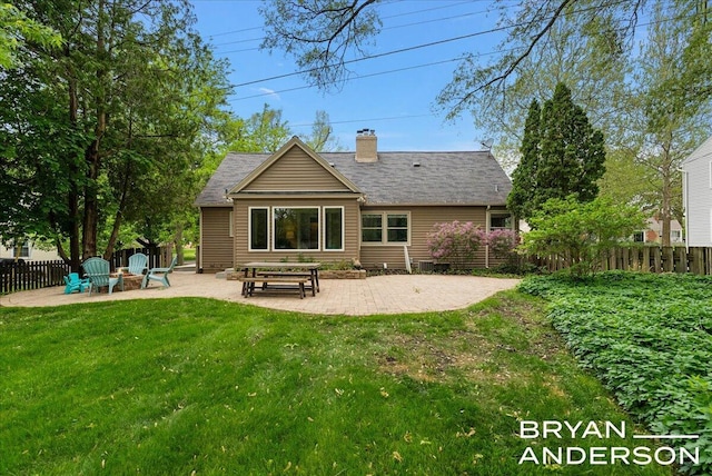 2120 Englewood Dr SE, East Grand Rapids, MI 49506 - rear view of property featuring a patio area and a chimney