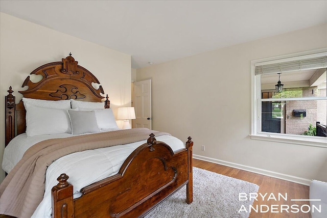 2120 Englewood Dr SE, East Grand Rapids, MI 49506 - bedroom with wood finished floors and baseboards