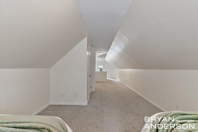 2120 Englewood Dr SE, East Grand Rapids, MI 49506 - bedroom with lofted ceiling, carpet floors, and baseboards