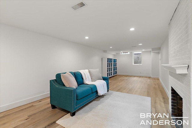2120 Englewood Dr SE, East Grand Rapids, MI 49506 - sitting room featuring light wood-type flooring, recessed lighting, a fireplace, and baseboards
