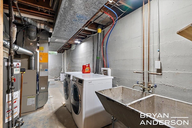 2120 Englewood Dr SE, East Grand Rapids, MI 49506 - unfinished below grade area with washer and dryer, water heater, and a sink