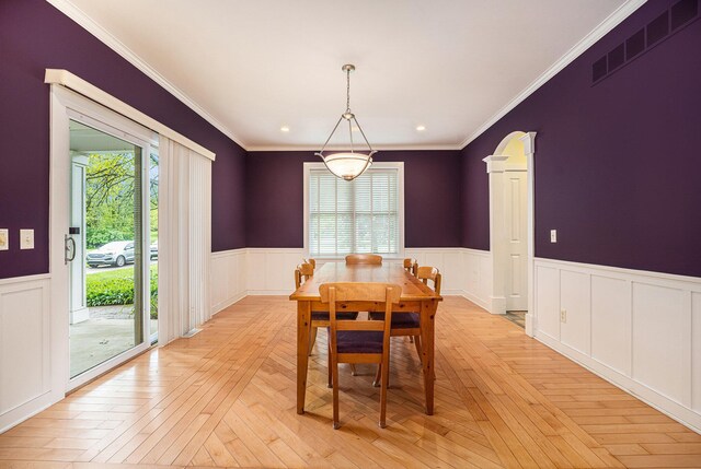 9266 Maricopa Trl, Kalamazoo, MI 49009 - dining room with wainscoting, crown molding, light wood finished floors, and recessed lighting