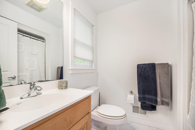 9266 Maricopa Trl, Kalamazoo, MI 49009 - bathroom with toilet, vanity, and tile patterned flooring