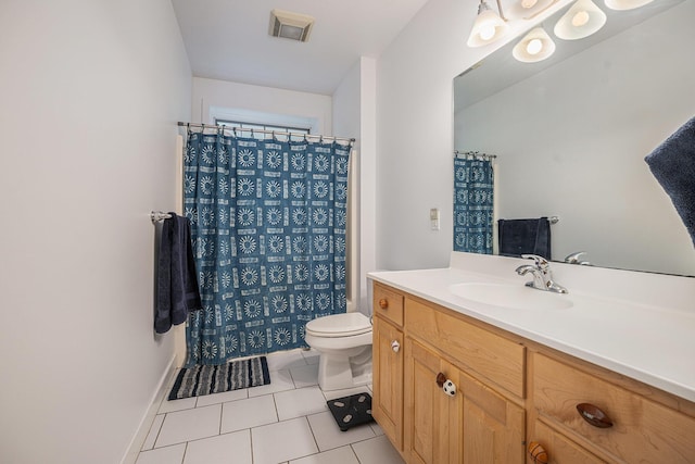 9266 Maricopa Trl, Kalamazoo, MI 49009 - full bathroom with tile patterned flooring, toilet, vanity, curtained shower, and baseboards