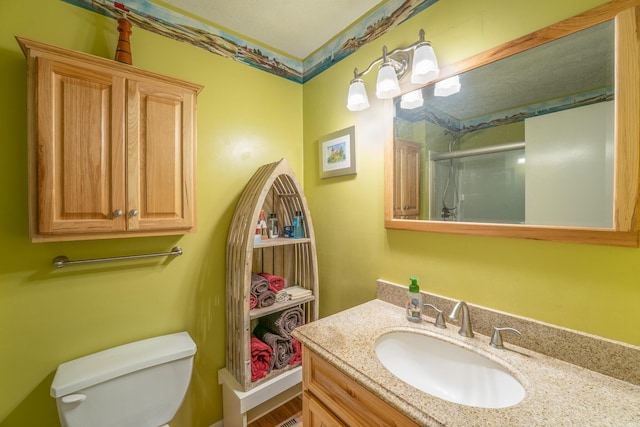 1605 Suffolk Ave, Portage, MI 49024 - bathroom with toilet, vanity, and an enclosed shower