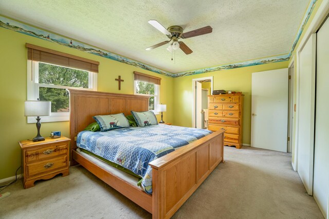 1605 Suffolk Ave, Portage, MI 49024 - bedroom with light carpet, a textured ceiling, a ceiling fan, and baseboards