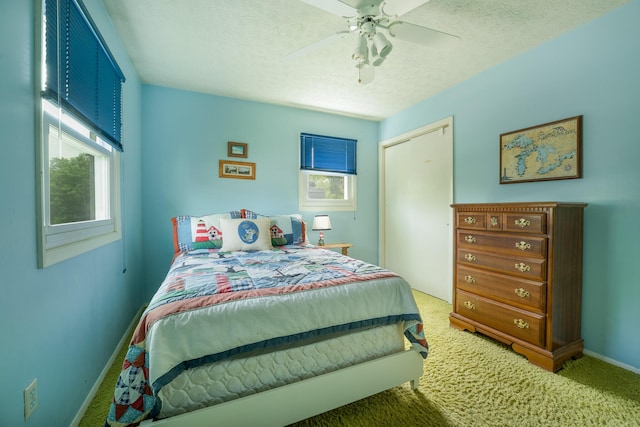 1605 Suffolk Ave, Portage, MI 49024 - bedroom featuring carpet, a closet, baseboards, a textured ceiling, and a ceiling fan