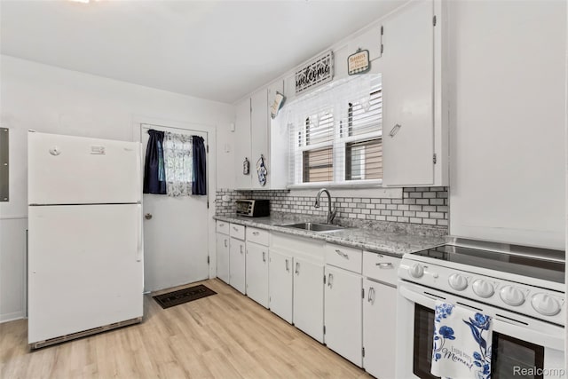 1141 E Madge Ave, Hazel Park, MI 48030 - kitchen featuring white appliances, a sink, light wood-type flooring, backsplash, and white cabinetry