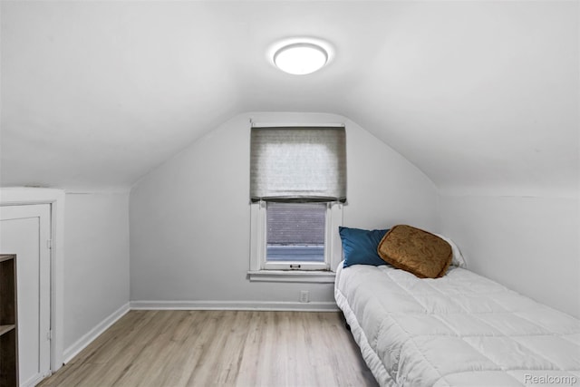 1141 E Madge Ave, Hazel Park, MI 48030 - bedroom with wood finished floors, vaulted ceiling, and baseboards