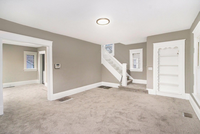 905 Lane Ave, Kalamazoo, MI 49001 - entryway featuring carpet flooring, stairs, and baseboards