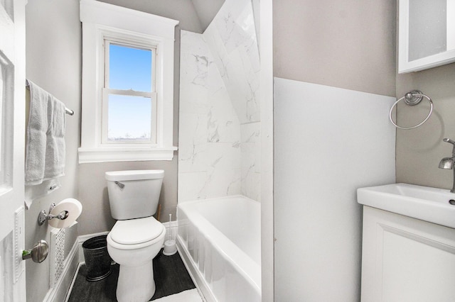 905 Lane Ave, Kalamazoo, MI 49001 - bathroom with toilet, vanity, shower / tub combination, baseboards, and wood finished floors