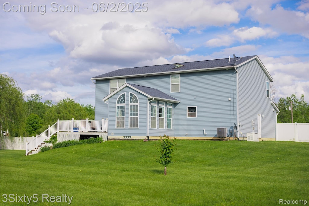 13972 Stowell Rd, Dundee, MI 48131 - back of property with central AC unit, a wooden deck, and stairway
