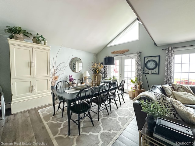 2109 S Lakeshore Rd, Harbor Beach, MI 48441 - dining space with healthy amount of natural light, light wood finished floors, french doors, and high vaulted ceiling