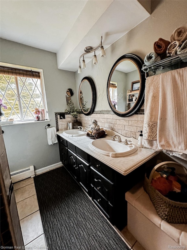 2109 S Lakeshore Rd, Harbor Beach, MI 48441 - full bathroom featuring baseboard heating, backsplash, tile patterned flooring, and double vanity
