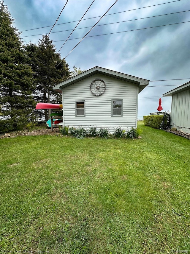 2109 S Lakeshore Rd, Harbor Beach, MI 48441 - view of property exterior with a yard