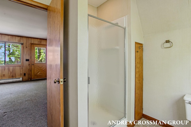 5011 Rosabelle Beach Ave, Holland, MI 49424 - bathroom with a stall shower, a baseboard heating unit, toilet, and wooden walls