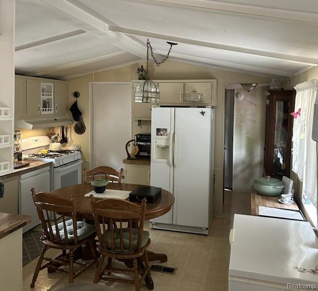 2999 Copeland Rd, Port Austin, MI 48467 - kitchen with white appliances, white cabinetry, under cabinet range hood, and dark countertops