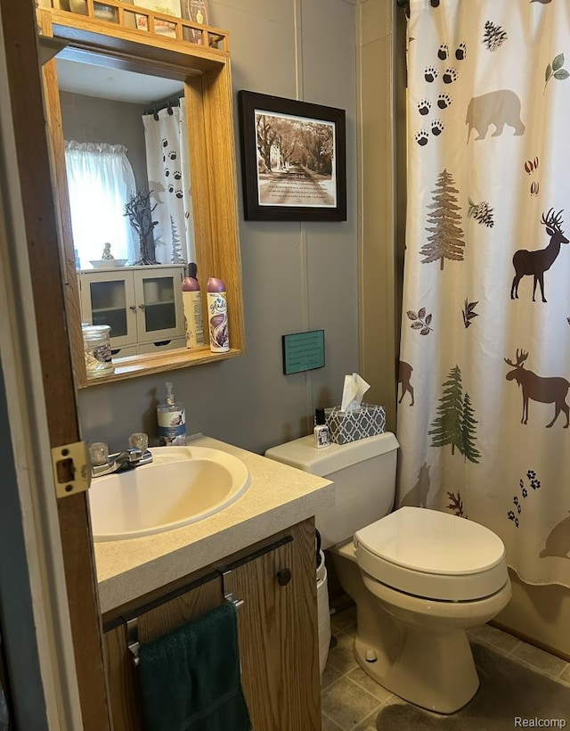 2999 Copeland Rd, Port Austin, MI 48467 - bathroom with toilet, vanity, tile patterned flooring, and curtained shower