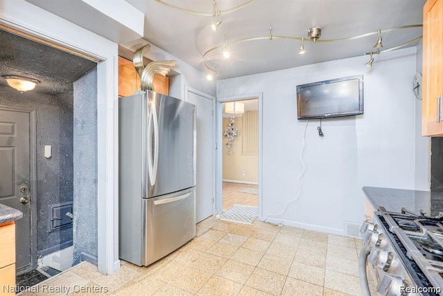 29249 Everett St, Southfield, MI 48076 - kitchen featuring stainless steel appliances, baseboards, dark countertops, and granite floors