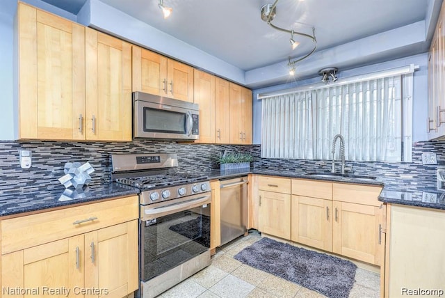 29249 Everett St, Southfield, MI 48076 - kitchen featuring appliances with stainless steel finishes, light brown cabinets, and a sink