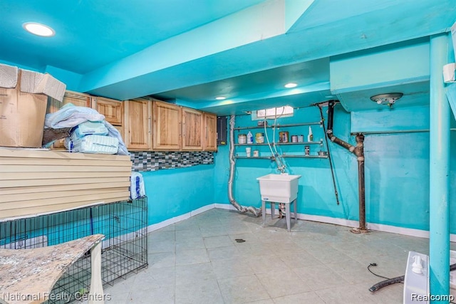 29249 Everett St, Southfield, MI 48076 - miscellaneous room with a sink, baseboards, and recessed lighting