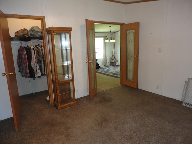 5925 113th Ave, Pullman, MI 49450 - hallway featuring carpet, a chandelier, and french doors