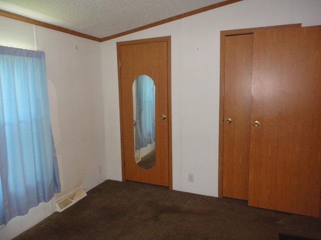 5925 113th Ave, Pullman, MI 49450 - unfurnished bedroom featuring carpet, multiple closets, a textured ceiling, vaulted ceiling, and crown molding
